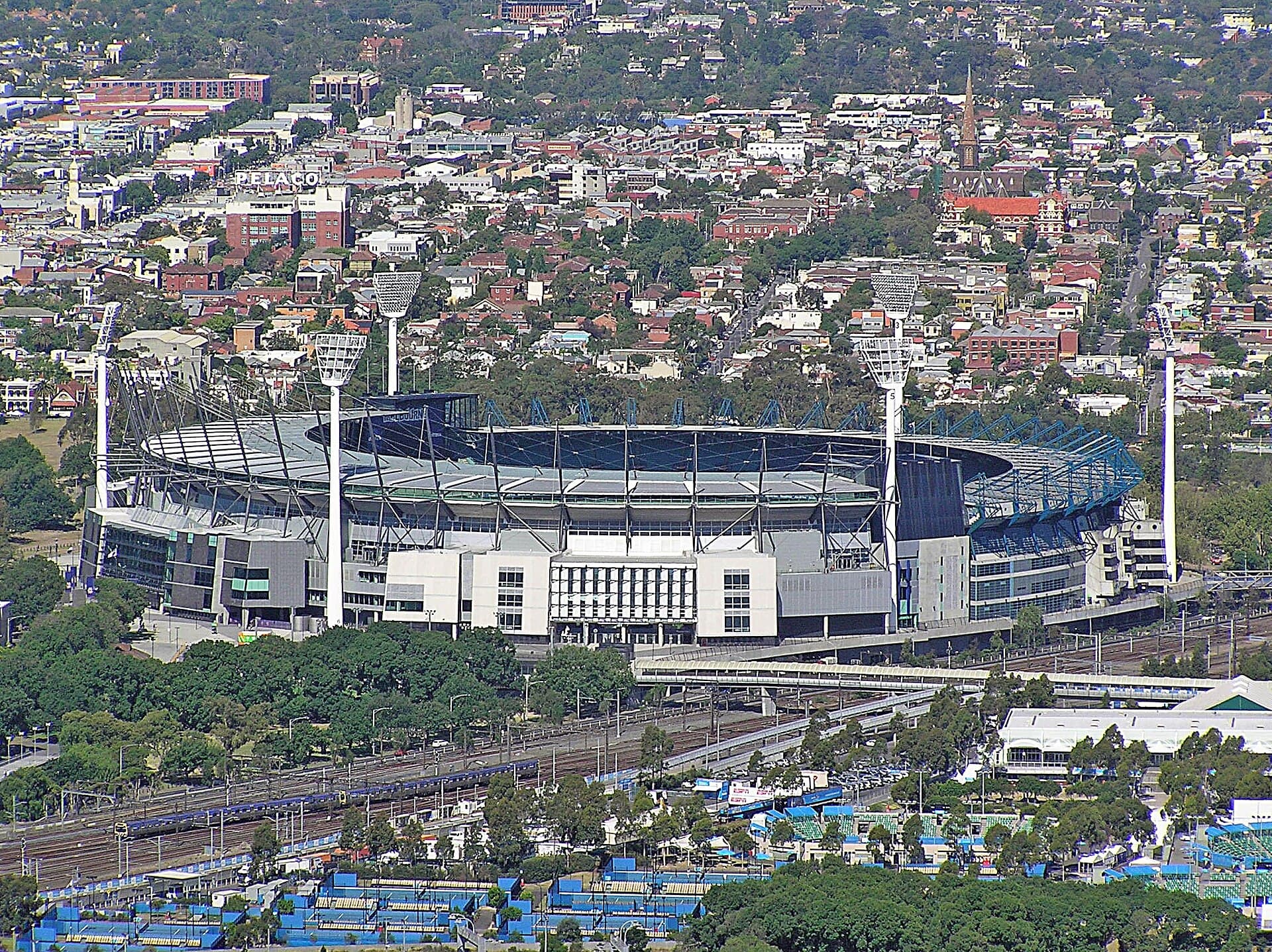 The Melbourne Cricket Ground filled for a match, with stands rising around the oval.